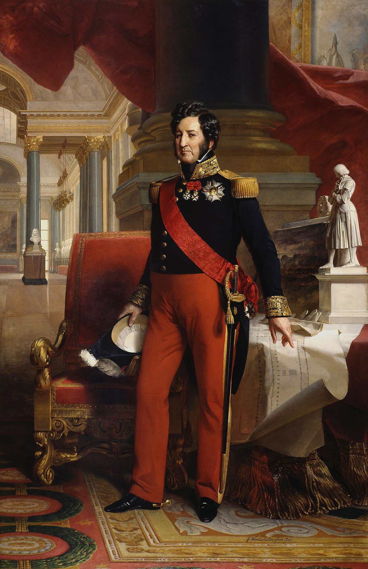 Full-length portrait of Louis Philippe I in a dark gold-trimmed uniform coat, red trousers, and a red sash, standing in a palace gallery