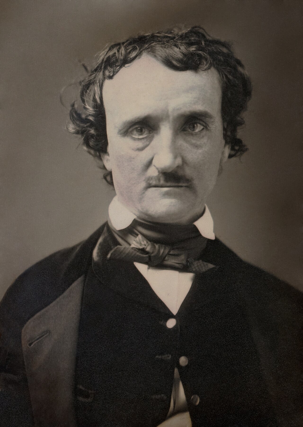 Restored daguerreotype portrait of Edgar Allan Poe, a dark-haired man with a mustache in a dark coat