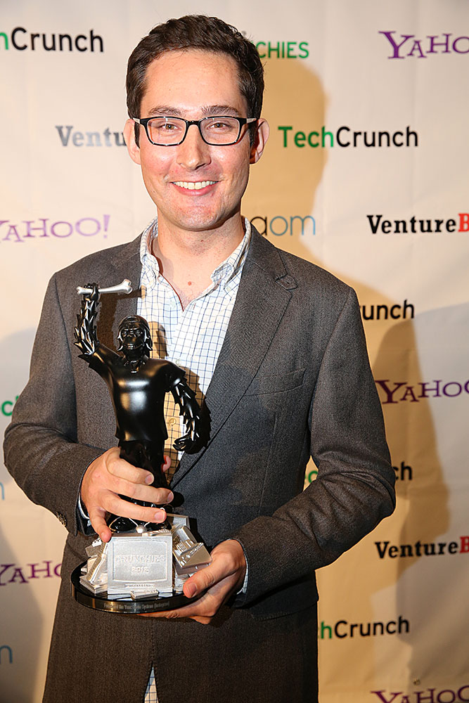 Kevin Systrom, co-founder of Instagram, smiling at an awards event in a dark suit